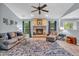 Comfortable living room with a cozy fireplace, hardwood floors, and ample seating at 1104 Briarwood Dr, Brownsburg, IN 46112