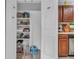 Organized pantry with shelving provides ample storage space in this home at 1104 Briarwood Dr, Brownsburg, IN 46112
