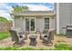 The backyard patio features outdoor seating, a grill, and space for relaxing and entertaining at 1104 Briarwood Dr, Brownsburg, IN 46112