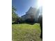 Landscaped backyard with green grass and backyard gym, offering outdoor activities and relaxation at 1128 S Pennsylvania St, Indianapolis, IN 46225