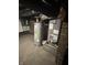 Basement features a water heater and HVAC system. Ideal for storage or future finishing at 1128 S Pennsylvania St, Indianapolis, IN 46225