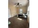 Bedroom with a ceiling fan, carpet flooring, and natural light from a window at 1128 S Pennsylvania St, Indianapolis, IN 46225
