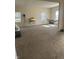 Large carpeted living room featuring bright windows and ample natural light, perfect for relaxation at 1128 S Pennsylvania St, Indianapolis, IN 46225