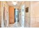 Bathroom with a linen cabinet, decorative tiles, and views into separate toilet and shower areas at 12144 Trolley Rd, Indianapolis, IN 46236