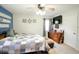 Bright bedroom with a TV, neutral carpet, and a large window for natural light at 12144 Trolley Rd, Indianapolis, IN 46236