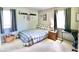 Spare bedroom with a plaid comforter set and a comfortable work space at 12144 Trolley Rd, Indianapolis, IN 46236
