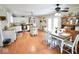 Open-concept kitchen featuring stainless steel appliances, a center island, and a dining area with a hutch at 12144 Trolley Rd, Indianapolis, IN 46236