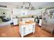 Bright kitchen with stainless steel appliances, center island, granite countertops, and ample cabinet space at 12144 Trolley Rd, Indianapolis, IN 46236