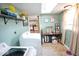 Functional laundry room with modern appliances, desk and storage with eat in kitchen just through doorway at 12144 Trolley Rd, Indianapolis, IN 46236