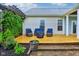 View of back deck, featuring wood floors, outdoor seating, a pergola, and a grill at 13145 Roma Bnd, Carmel, IN 46074