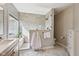 Bright bathroom featuring a glass shower, modern vanity, and marble floors at 13145 Roma Bnd, Carmel, IN 46074