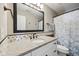 Traditional bathroom featuring granite countertops, a framed mirror, and a shower with curtain at 13145 Roma Bnd, Carmel, IN 46074