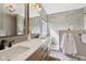 Bathroom features a double vanity with modern fixtures and a glass shower at 13145 Roma Bnd, Carmel, IN 46074