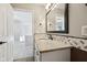Bathroom features a granite countertop, patterned backsplash, and modern fixtures at 13145 Roma Bnd, Carmel, IN 46074