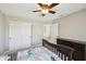 Bedroom with a ceiling fan, neutral walls, carpet flooring, and a closet for storage at 13145 Roma Bnd, Carmel, IN 46074