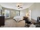 Neutral bedroom with carpet, ceiling fan and natural light at 13145 Roma Bnd, Carmel, IN 46074