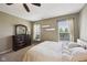 Serene bedroom retreat with dresser, plush bedding, and natural light at 13145 Roma Bnd, Carmel, IN 46074
