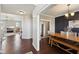 Open dining room with wood table, stylish seating, and elegant decor; living room in view at 13145 Roma Bnd, Carmel, IN 46074