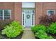 Inviting front entrance with a light blue door, decorative wreath, and colorful landscaping at 13145 Roma Bnd, Carmel, IN 46074
