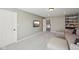 Spacious living room with plush seating, a large window, and a mounted TV at 13145 Roma Bnd, Carmel, IN 46074