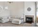Comfortable living room with fireplace, featuring a large sectional sofa for relaxation at 13145 Roma Bnd, Carmel, IN 46074