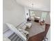 Aerial view of living room featuring a fireplace, large sectional sofa, vaulted ceilings, and abundant natural light at 13145 Roma Bnd, Carmel, IN 46074