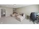 Spacious living room with plush seating, a large window, and a mounted TV at 13145 Roma Bnd, Carmel, IN 46074