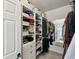 Bright walk-in closet features custom shelving, drawers, and storage options for maximum organization at 13145 Roma Bnd, Carmel, IN 46074