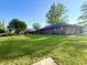 Exterior view of a brick single-story home with spacious yard at 1328 N 300 E, Anderson, IN 46012