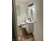 Bathroom featuring decorative light fixture and updated vanity at 1328 N 300 E, Anderson, IN 46012