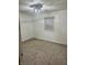 Bedroom showcasing neutral carpet, white walls, and modern ceiling fan at 1328 N 300 E, Anderson, IN 46012