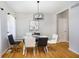 Modern dining room with a glass table, stylish chairs, and elegant lighting at 14135 Nicholas Dr, Carmel, IN 46074