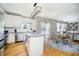 Open concept kitchen and dining area, featuring granite countertops, stainless appliances, and modern finishes at 14135 Nicholas Dr, Carmel, IN 46074