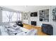 Comfortable living room with a cozy sofa, fireplace, and built-in shelves at 14135 Nicholas Dr, Carmel, IN 46074