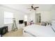 Spacious main bedroom featuring neutral carpet, white furniture, ceiling fan, and walk-in closet at 14135 Nicholas Dr, Carmel, IN 46074