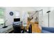 Office featuring glass desk, comfortable seating, and bright natural light at 14135 Nicholas Dr, Carmel, IN 46074