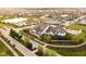 An aerial view of a grand community center, complete with pool, tennis courts, and verdant surroundings at 15116 Fenchurch Dr, Westfield, IN 46074
