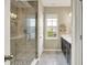 Bright bathroom featuring a glass shower and double vanity at 15116 Fenchurch Dr, Westfield, IN 46074