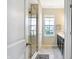 Bathroom with a glass-enclosed shower and a vanity featuring dark wood cabinets and a white countertop at 15116 Fenchurch Dr, Westfield, IN 46074