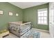 Bedroom featuring an olive green accent wall and large window at 15116 Fenchurch Dr, Westfield, IN 46074