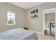 Neutral bedroom features window, bookshelf and view of staircase at 15116 Fenchurch Dr, Westfield, IN 46074