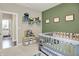 Bedroom featuring an olive green accent wall, toys and play area at 15116 Fenchurch Dr, Westfield, IN 46074