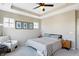 Comfortable bedroom with neutral decor, multiple windows, and a cozy sitting area for relaxation at 15116 Fenchurch Dr, Westfield, IN 46074