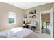 Bright bedroom with a view, a desk area, and shelving, perfect for relaxation at 15116 Fenchurch Dr, Westfield, IN 46074