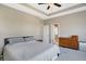 Spacious bedroom with a bed, dresser, and a glimpse into an en-suite bathroom; a comfortable retreat at 15116 Fenchurch Dr, Westfield, IN 46074