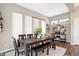 Comfortable dining area offers natural light and modern decor, adjacent to console and shelving at 15116 Fenchurch Dr, Westfield, IN 46074