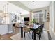 This dining area flows seamlessly into an open concept living space and features abundant natural light at 15116 Fenchurch Dr, Westfield, IN 46074