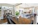 This dining area is adjacent to a modern kitchen with an open floor plan and contemporary decor at 15116 Fenchurch Dr, Westfield, IN 46074