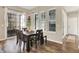 Dining area with a dark wood table and view to the patio through sliding doors creating a great ambiance at 15116 Fenchurch Dr, Westfield, IN 46074