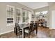 Bright dining area with natural light, a rustic wood table, and an open view enhancing the room's airy feel at 15116 Fenchurch Dr, Westfield, IN 46074